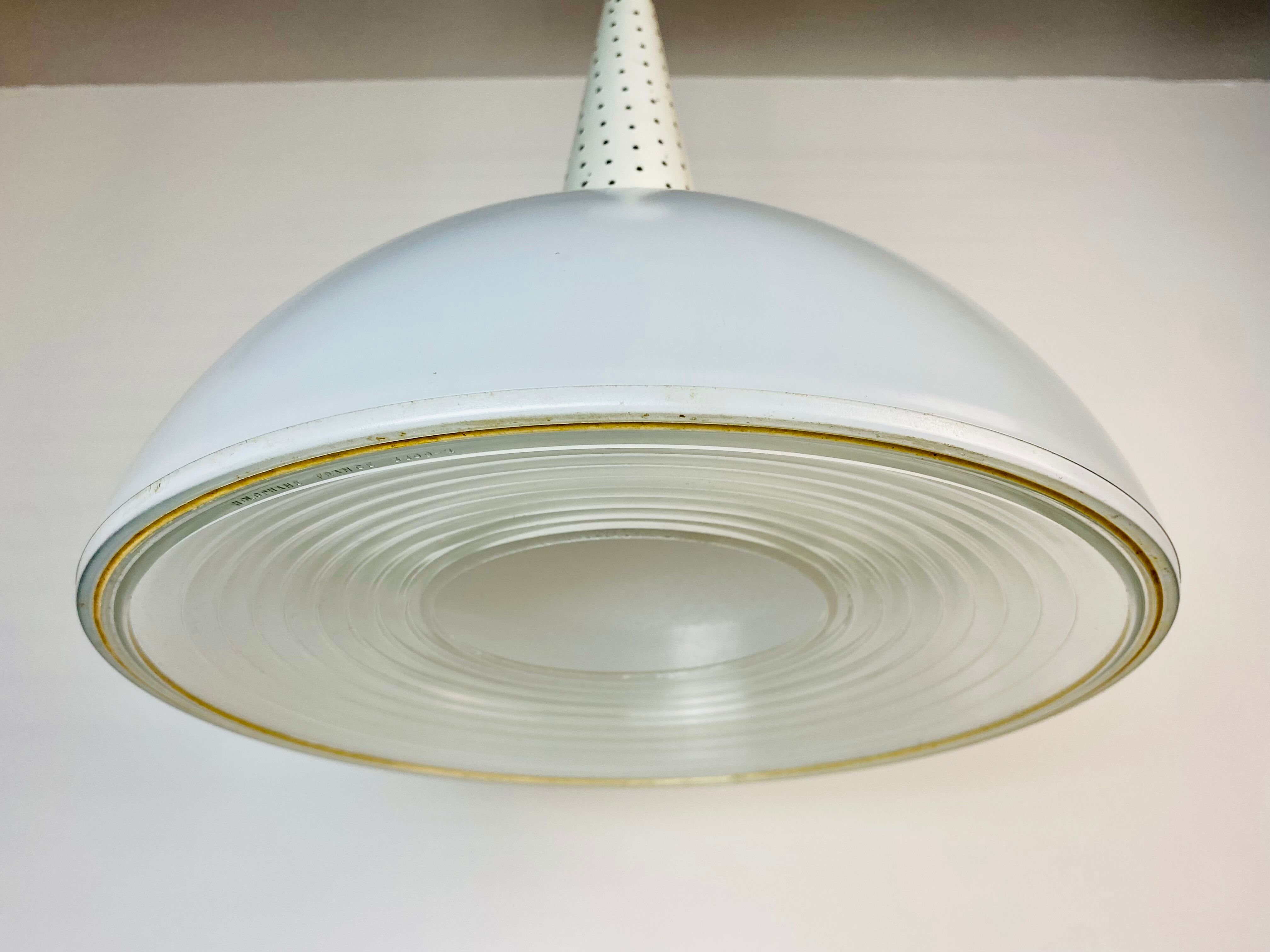 Perforated metal suspension holophanous glass