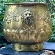 Large brass lion planter with a hallmark from the 19th century.