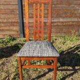 Set of 8 teak lounge chairs with high backs and zebra-striped seats