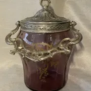 Purple glass biscuit barrel with painted gold arabesque decorations for cakes.