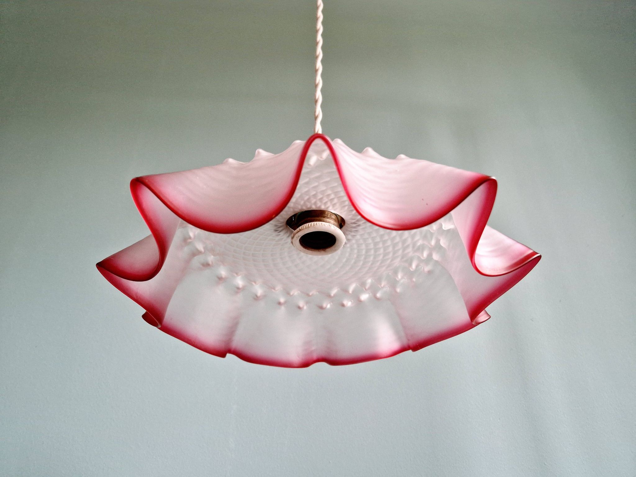 Pair of clear and pink satin glass scalloped pendant lights, 1920s-30s