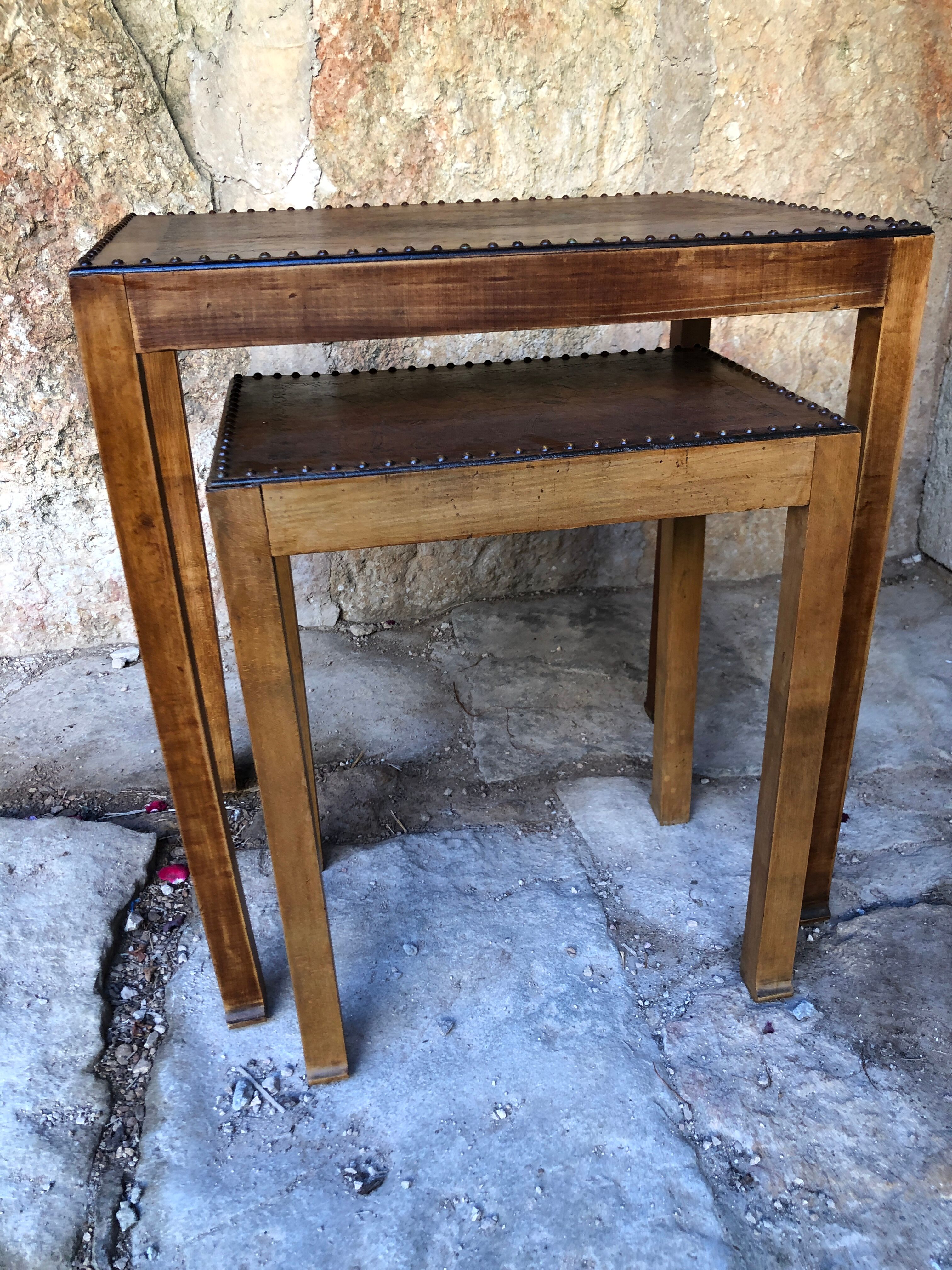 Pair of studded nesting tables from the 1930s.