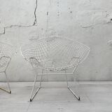 Pair of armchairs in white patinated mesh metal.