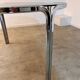 Table ronde vintage tubulaire en métal et verre fumé design année 70