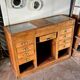 Counter, glass-fronted wooden workbench in dark wood, 8 drawers.