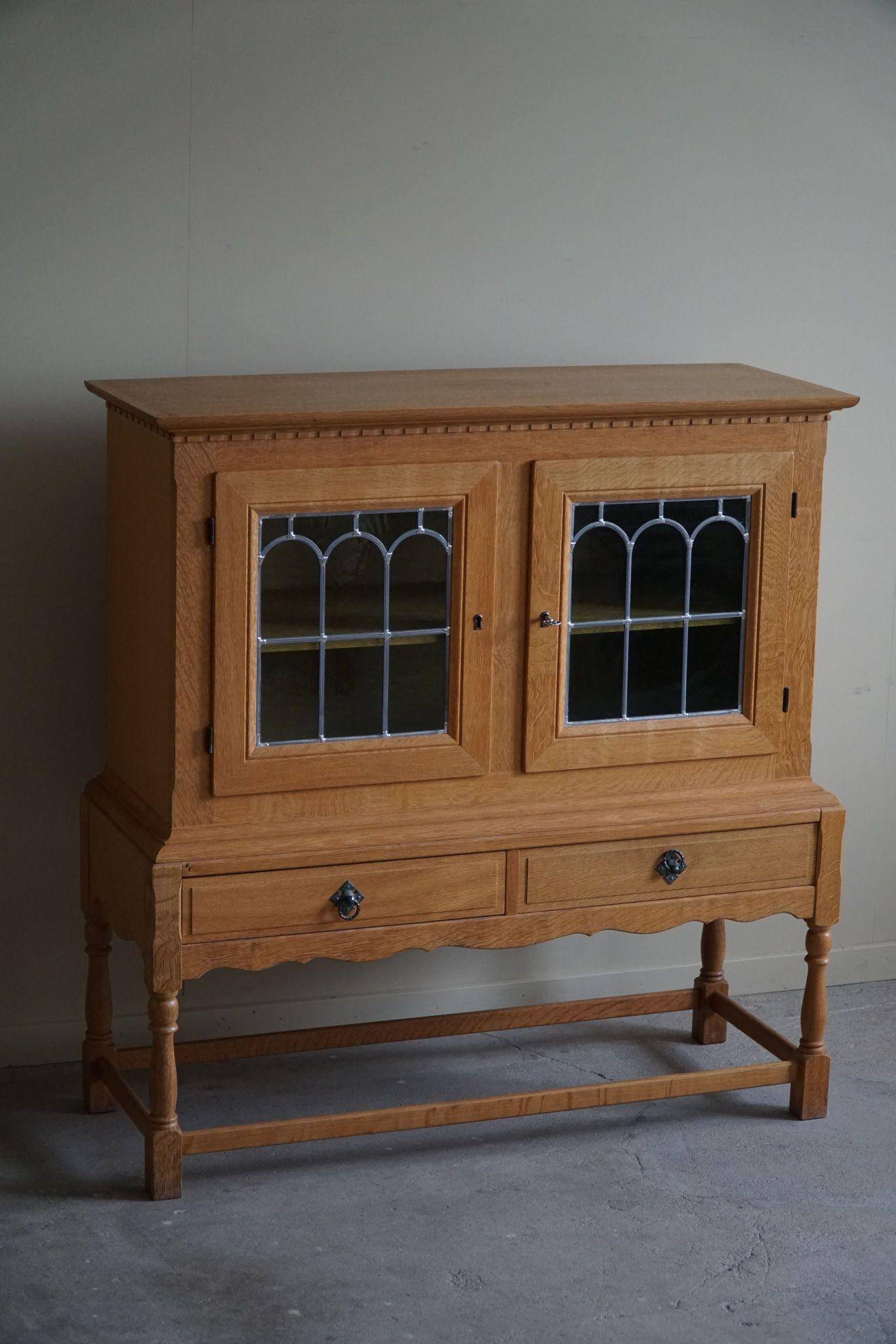 20th-century solid oak display cabinet with a glass front, by a Danish cabinetmaker.