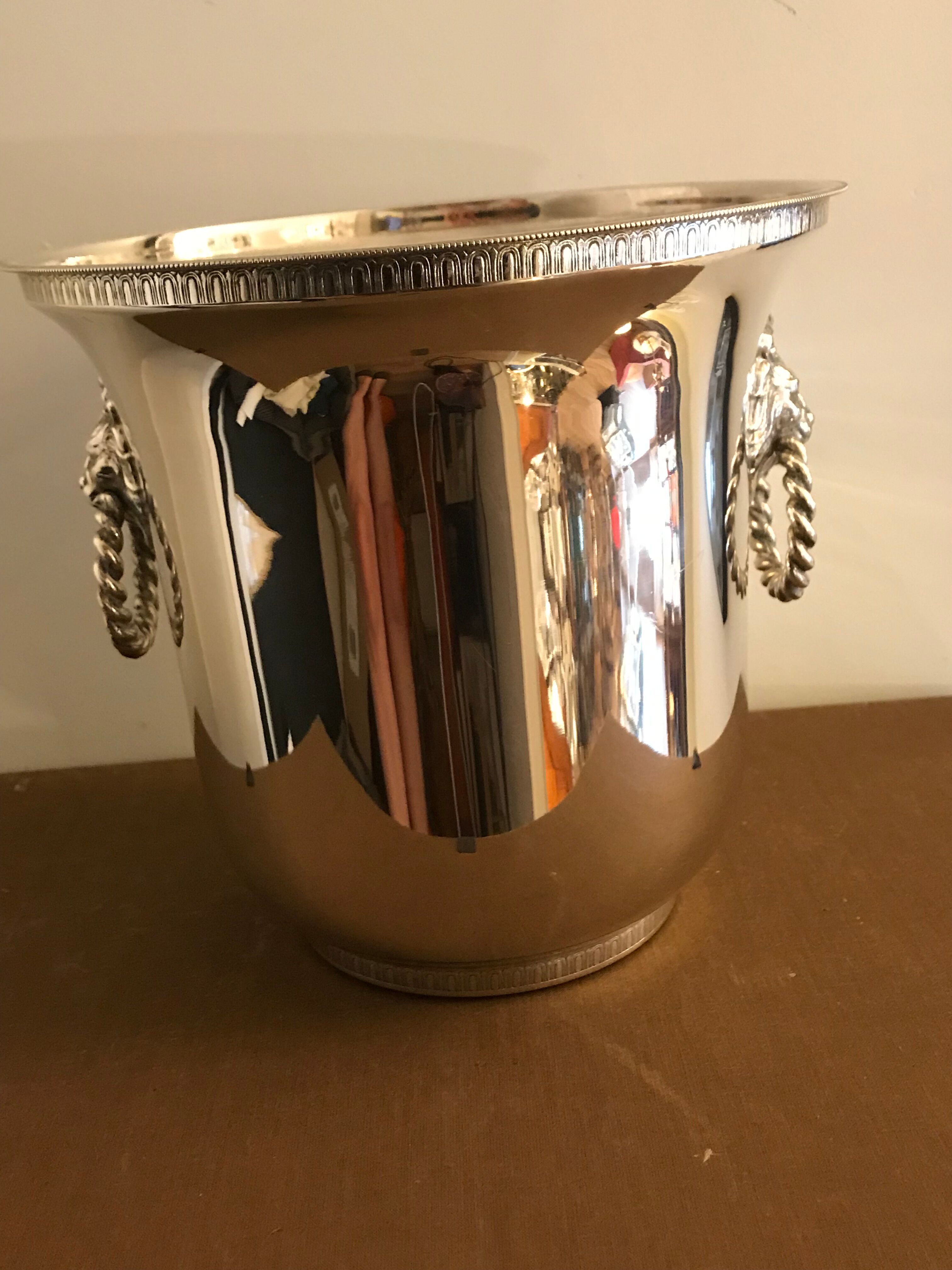 Ancient champagne bucket in silver metal with lion heads