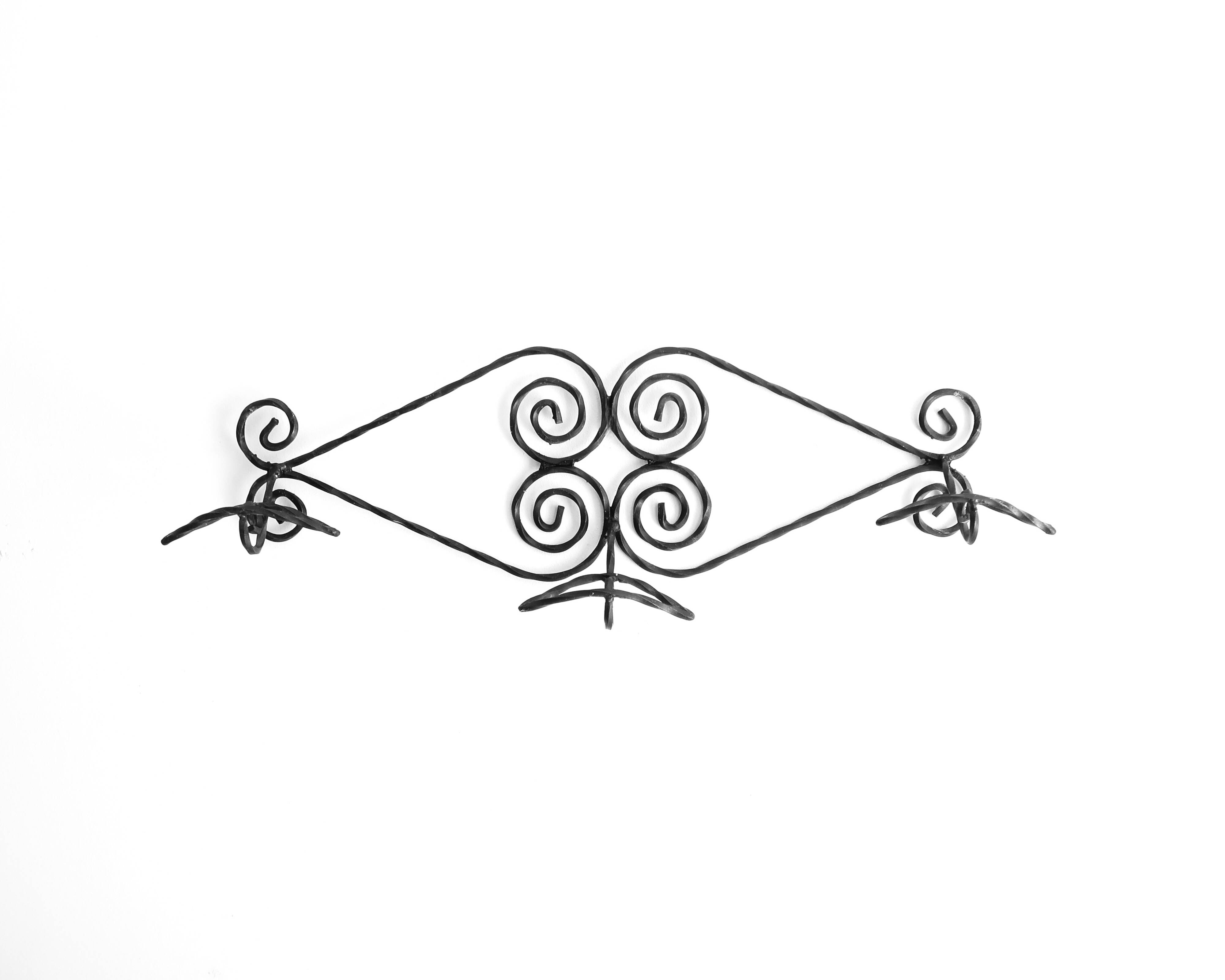 Twisted wrought iron wall coat rack with three hooks