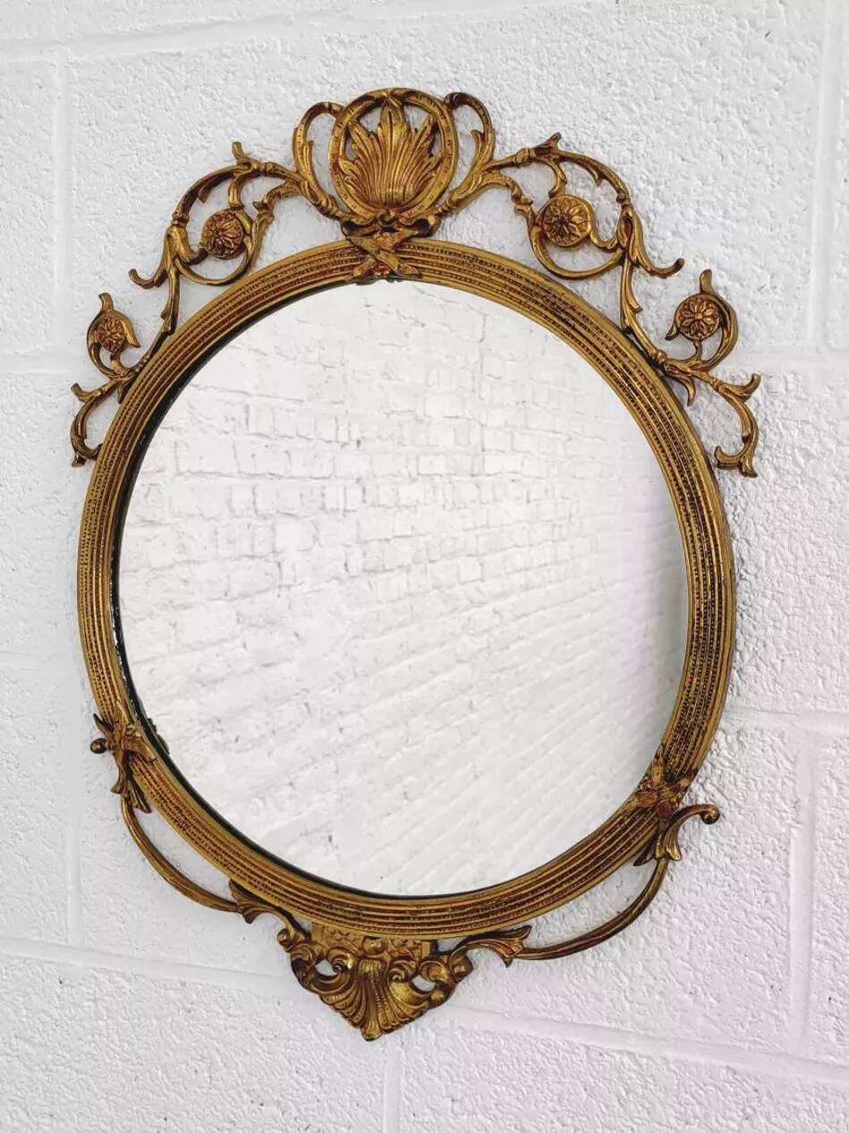 Round brass medallion style mirror