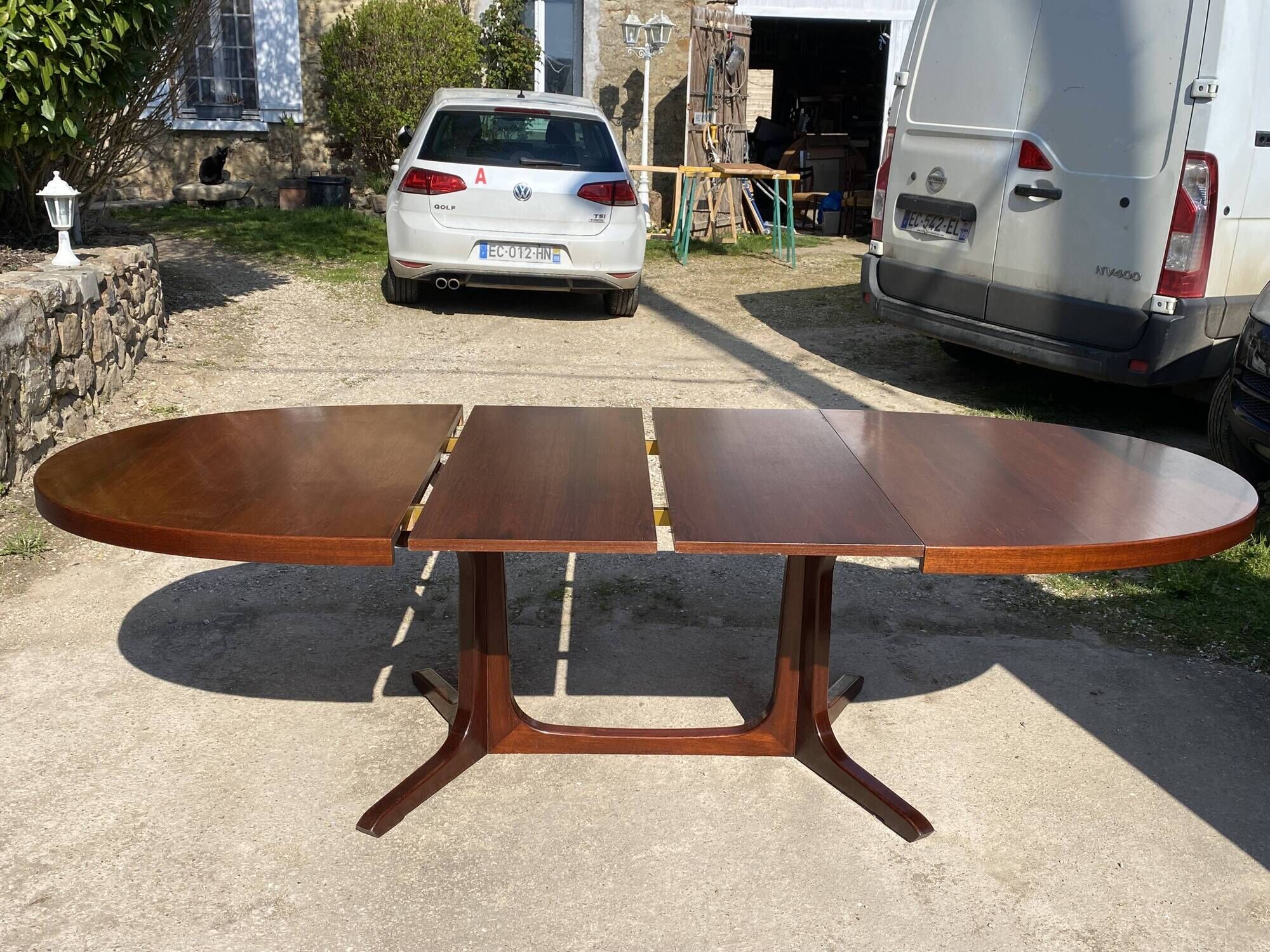 Baumann round oval extendable Scandinavian table in rosewood with 2 extensions.