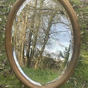 Bevelled golden oval mirror, 79 x 59 cm