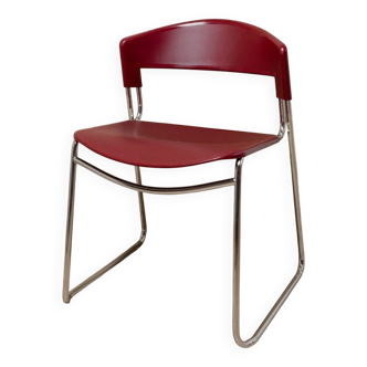 Red plastic-seat stacking chair with chrome frame by Paolo Favaretto for Assisa (Italy 1986) – vintage design