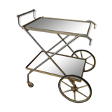 Rolling dessert in gold metal and trays in black formica