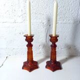 Pair of amber glass torches decorated with gothic motifs