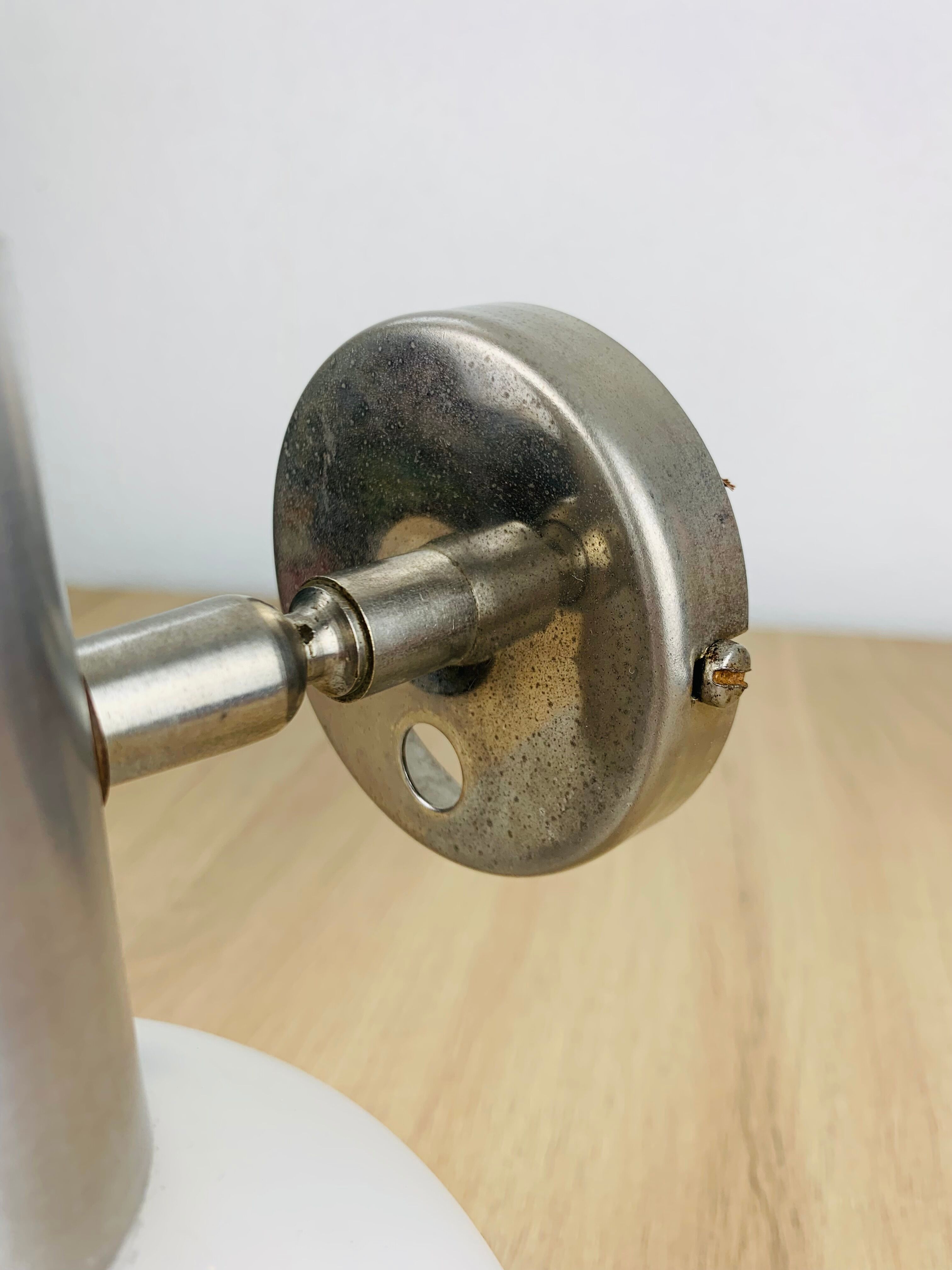 Space age opaline globe wall light, adjustable, and brushed metal, 1960s.