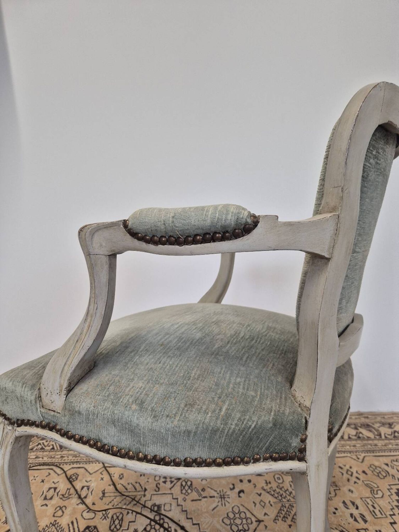Louis XV style cabriolet armchair in patinated wood and velvet