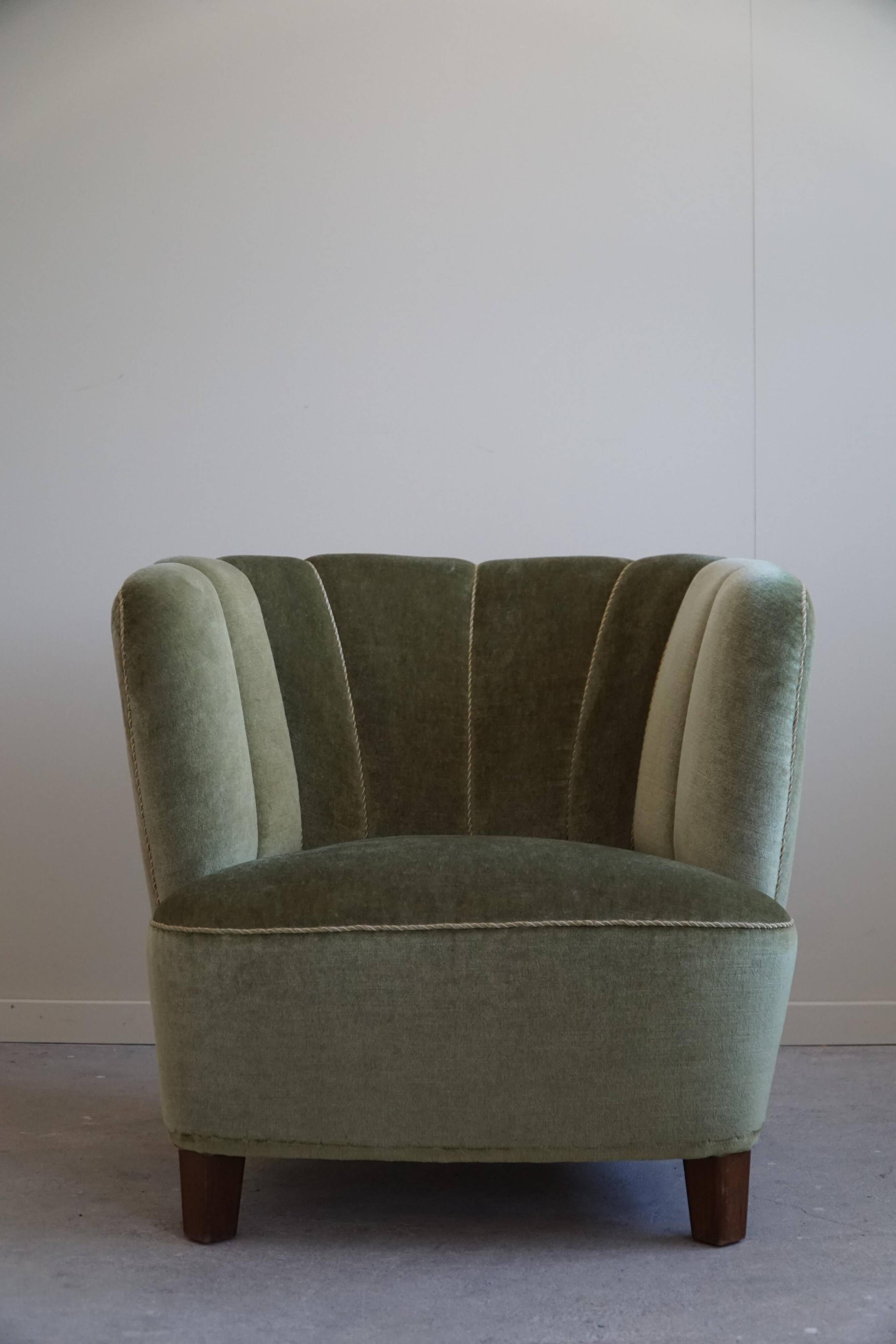 Curved Danish club chair from the mid-century, in the style of Viggo Boesen, 1940s.