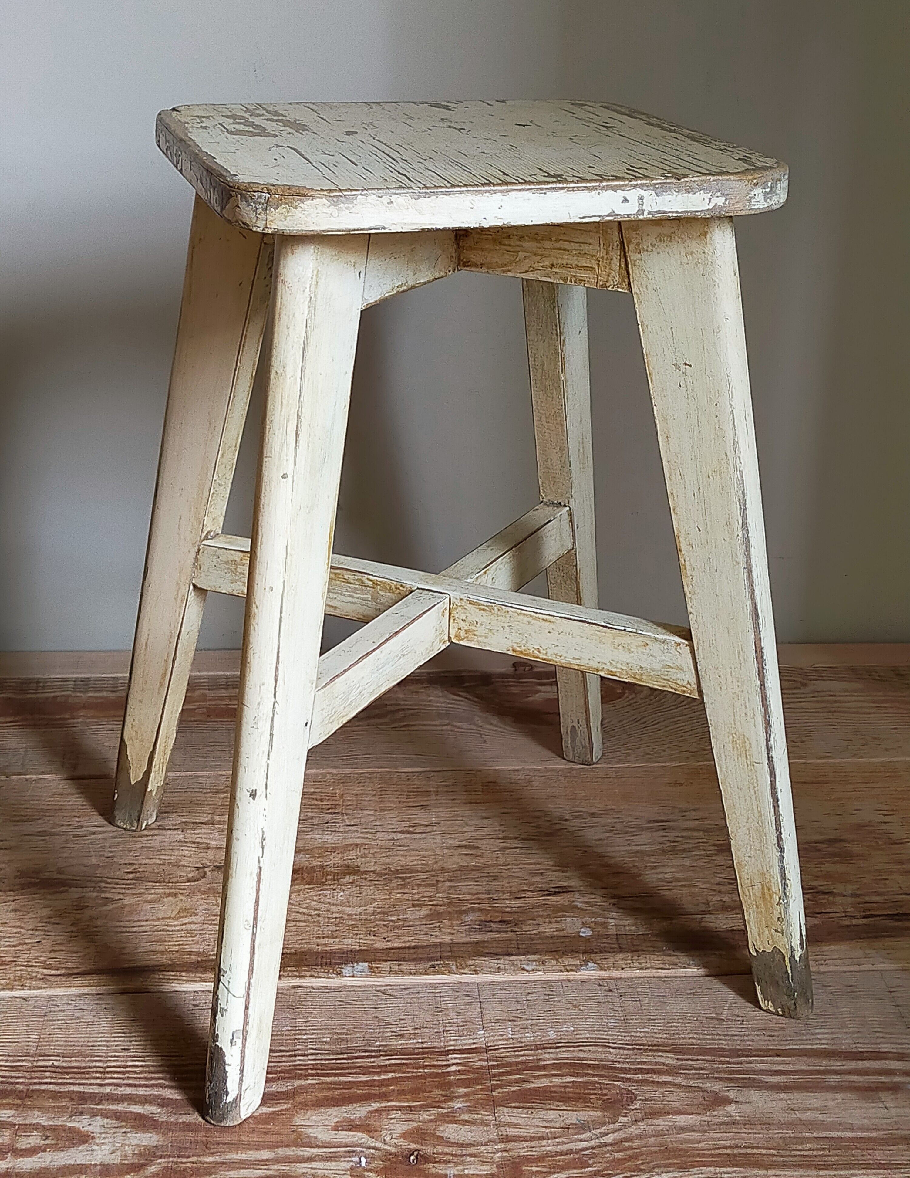 Old workshop stool in patinated solid wood
