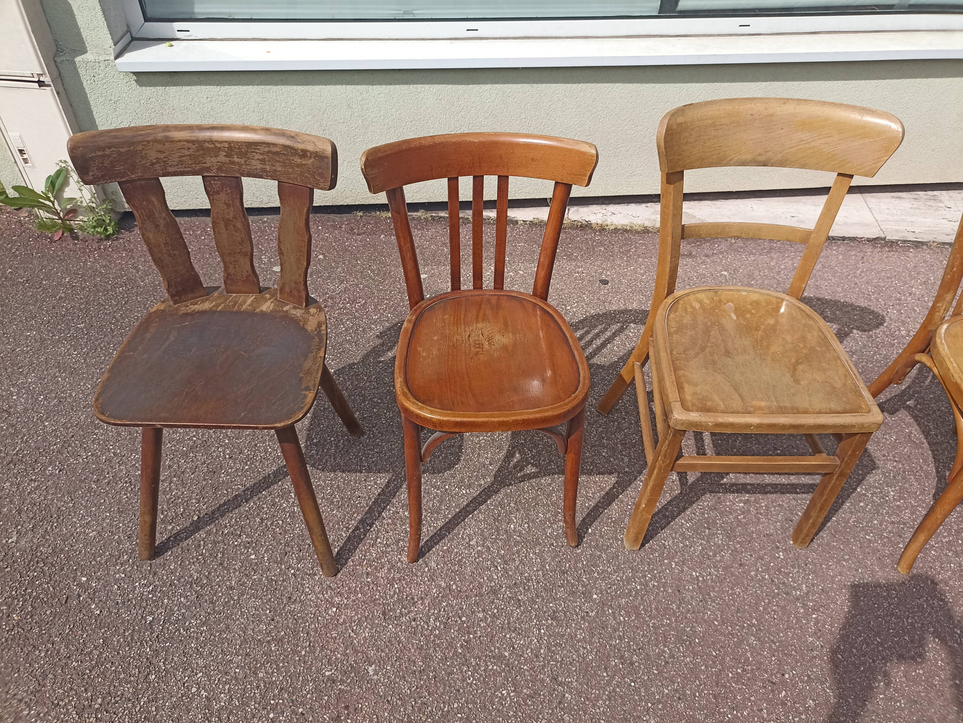 Set of 12 mismatched wooden bistro chairs