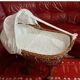 Vintage 1970s wicker cradle on wheels