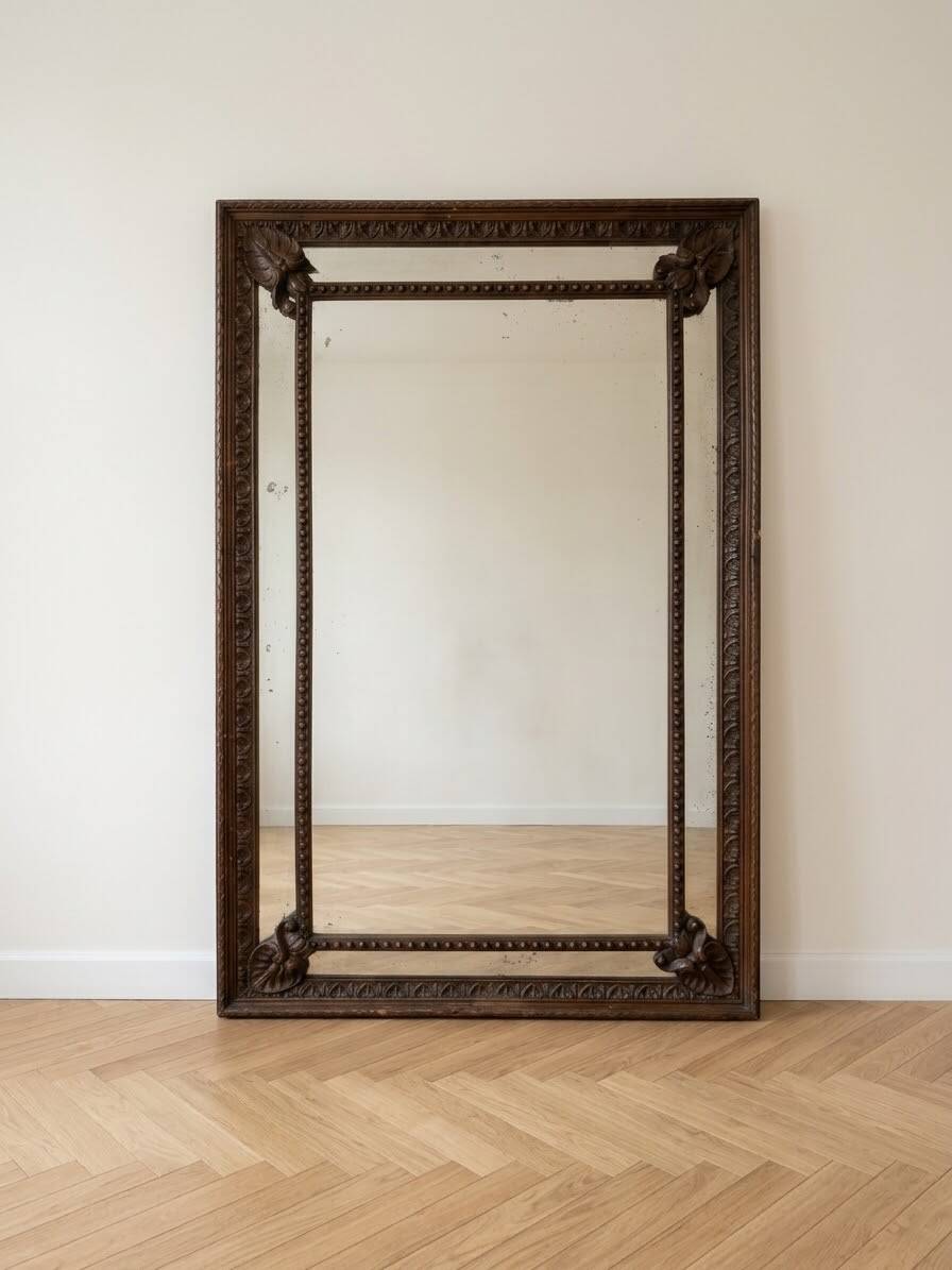 Large antique mirror in carved wood