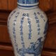 Ancient Chinese vase with blue decoration of sage and inscriptions