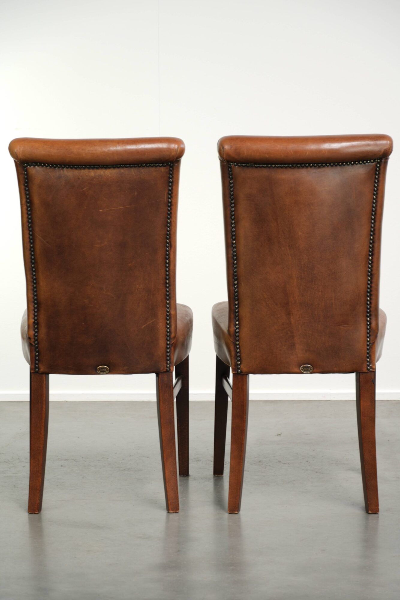 Set of 6 sheepskin dining chairs in a cognac colour with a lovely patina