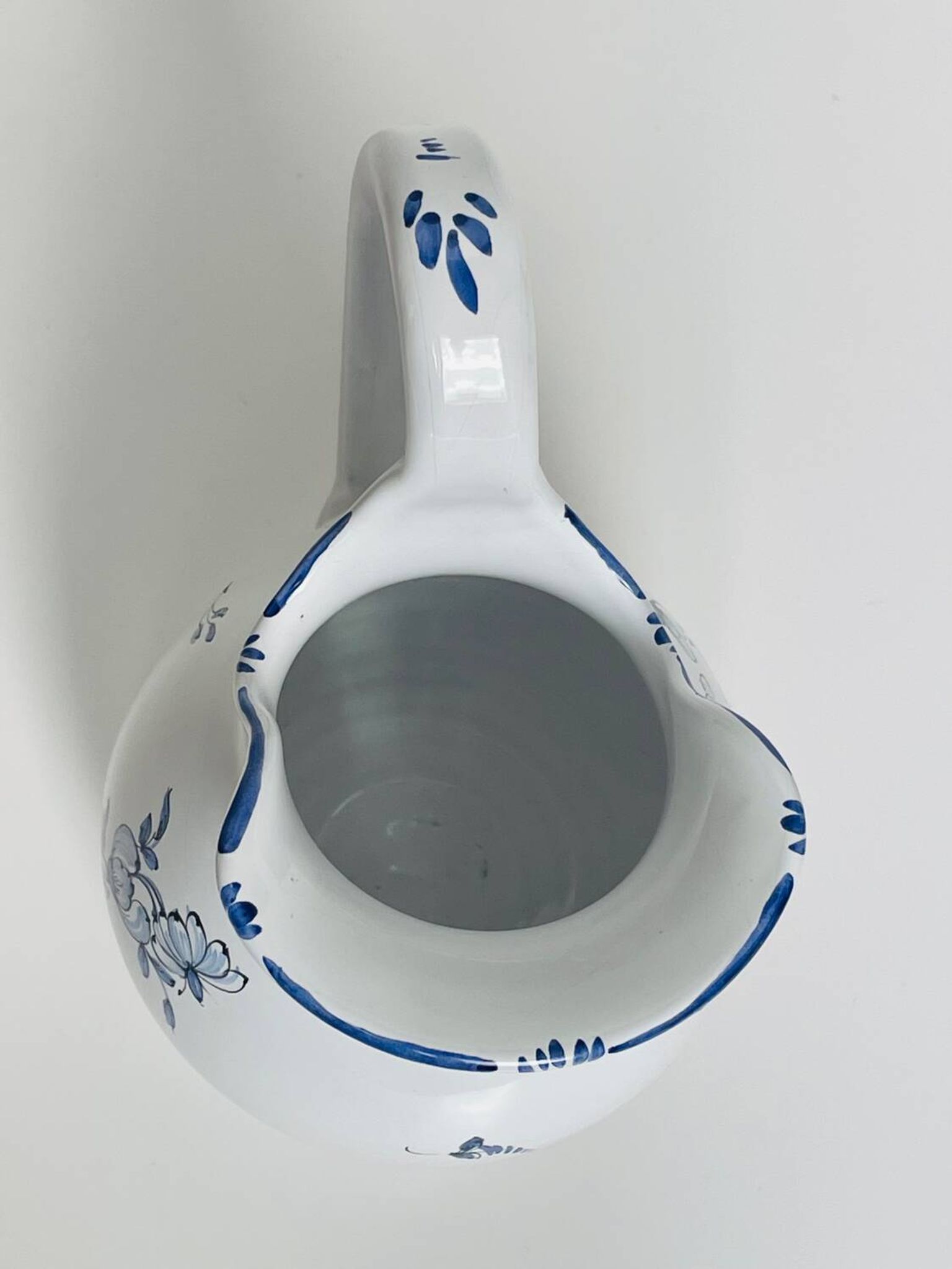 Moustiers pitcher with blue floral decoration