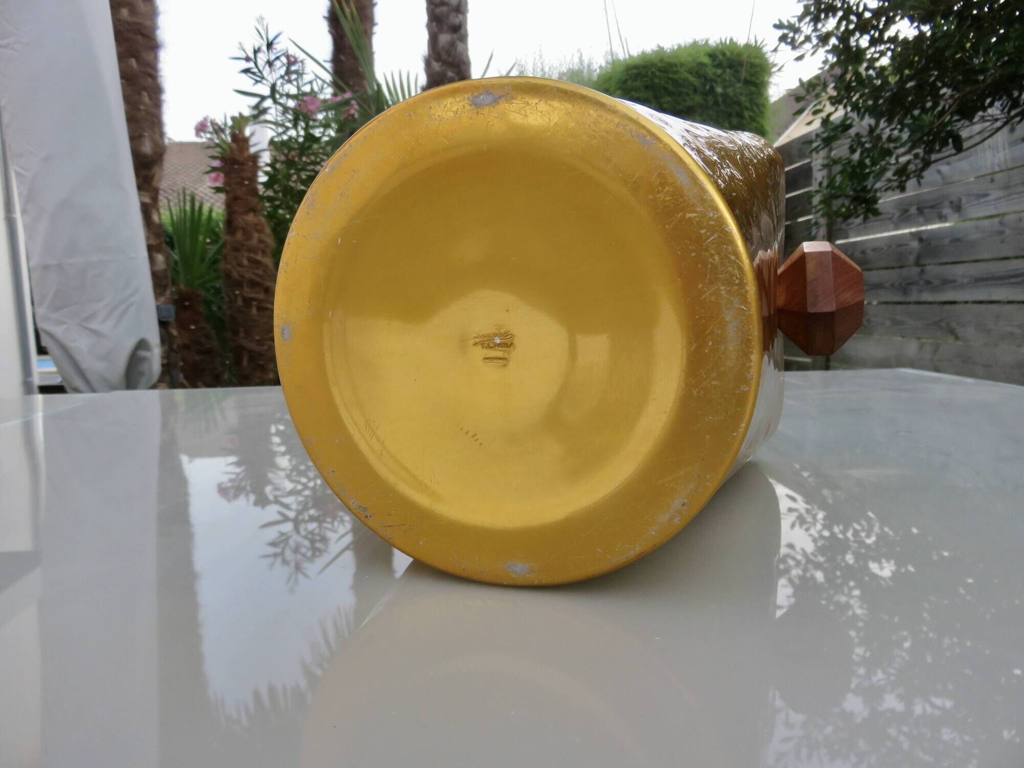 Gold anodised aluminium ice bucket, teak handles, signed T.L PARIS.