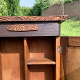 Old carved wooden medicine cabinet with beveled mirror