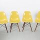 Set of 4 DSW chairs by Charles Eames - yellow fibreglass edition by Herman.