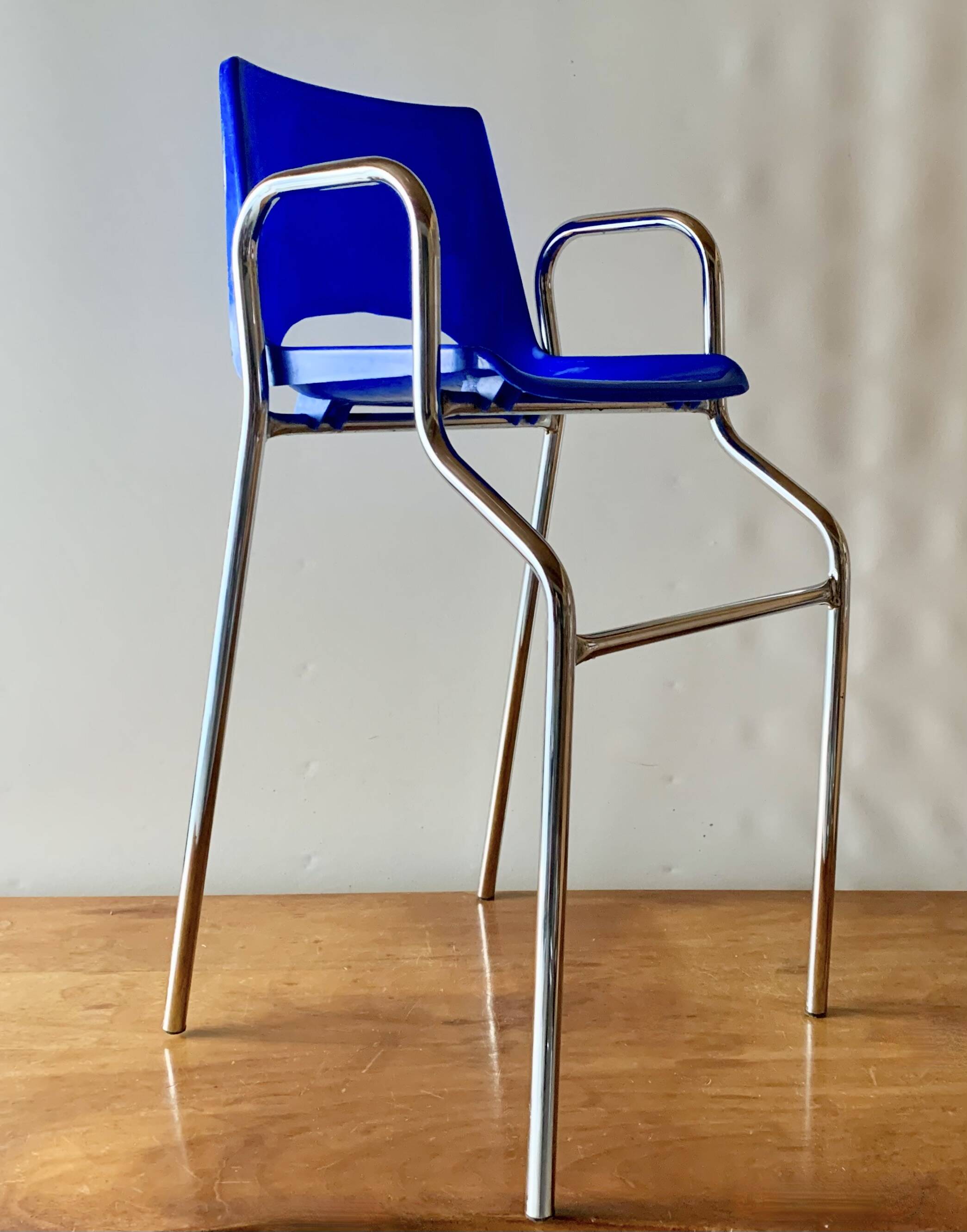 Vintage high chair for children in chrome metal and blue plastic