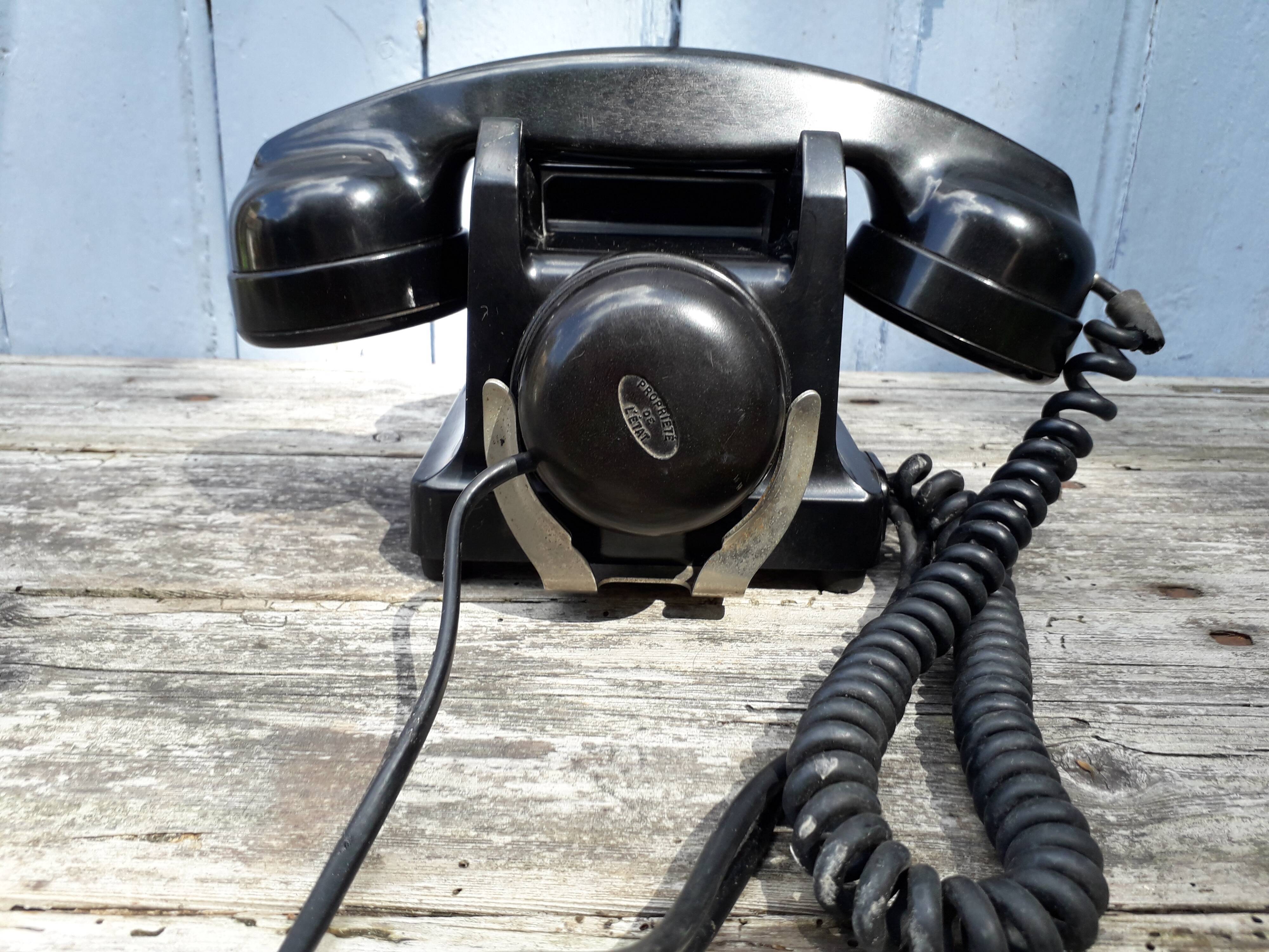 Phone has dial in bakelite