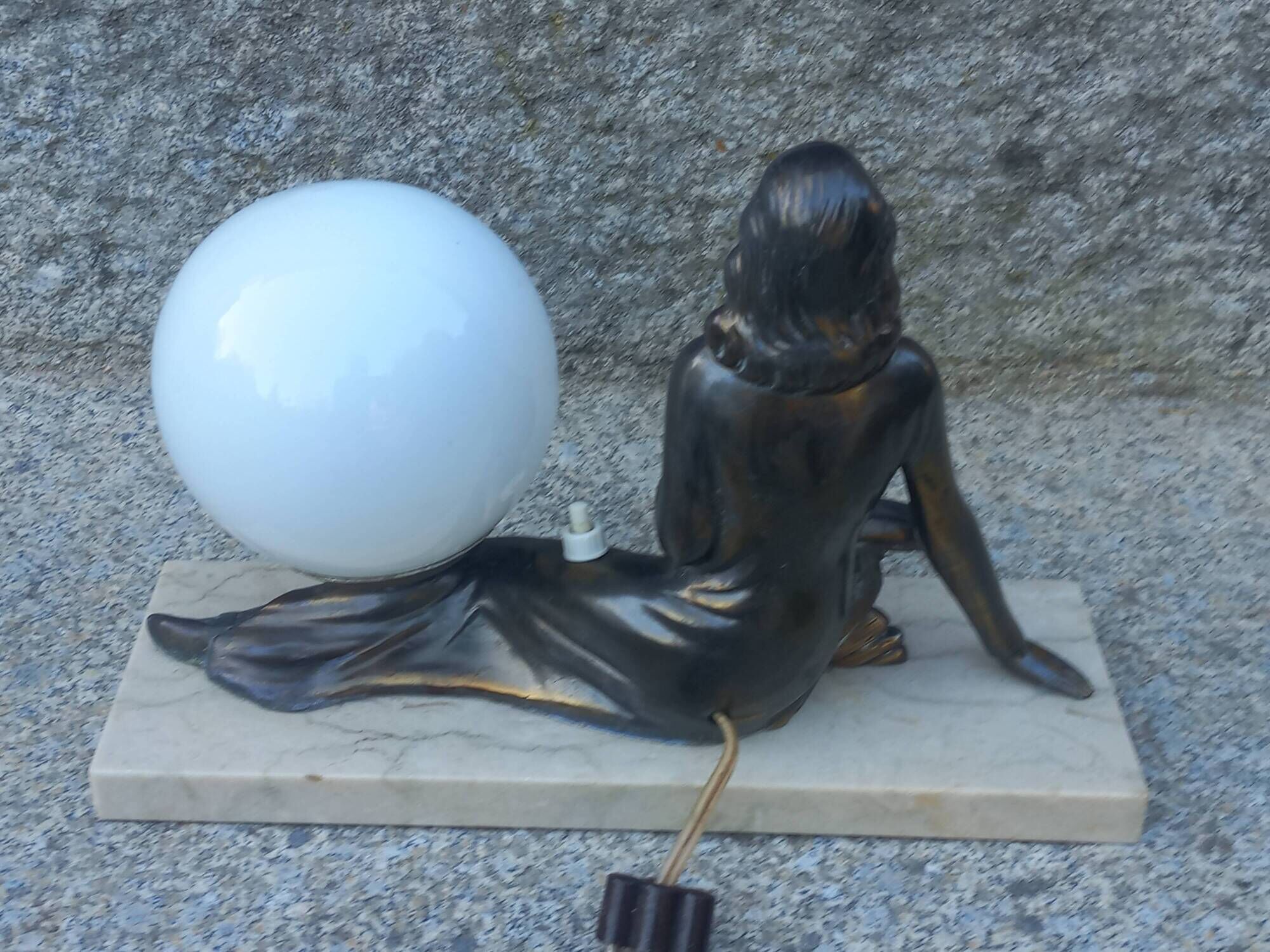 Art Deco lamp in cast iron and marble with a white opaline globe.