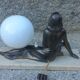 Art Deco lamp in cast iron and marble with a white opaline globe.