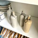 4 beige glazed stoneware bottles