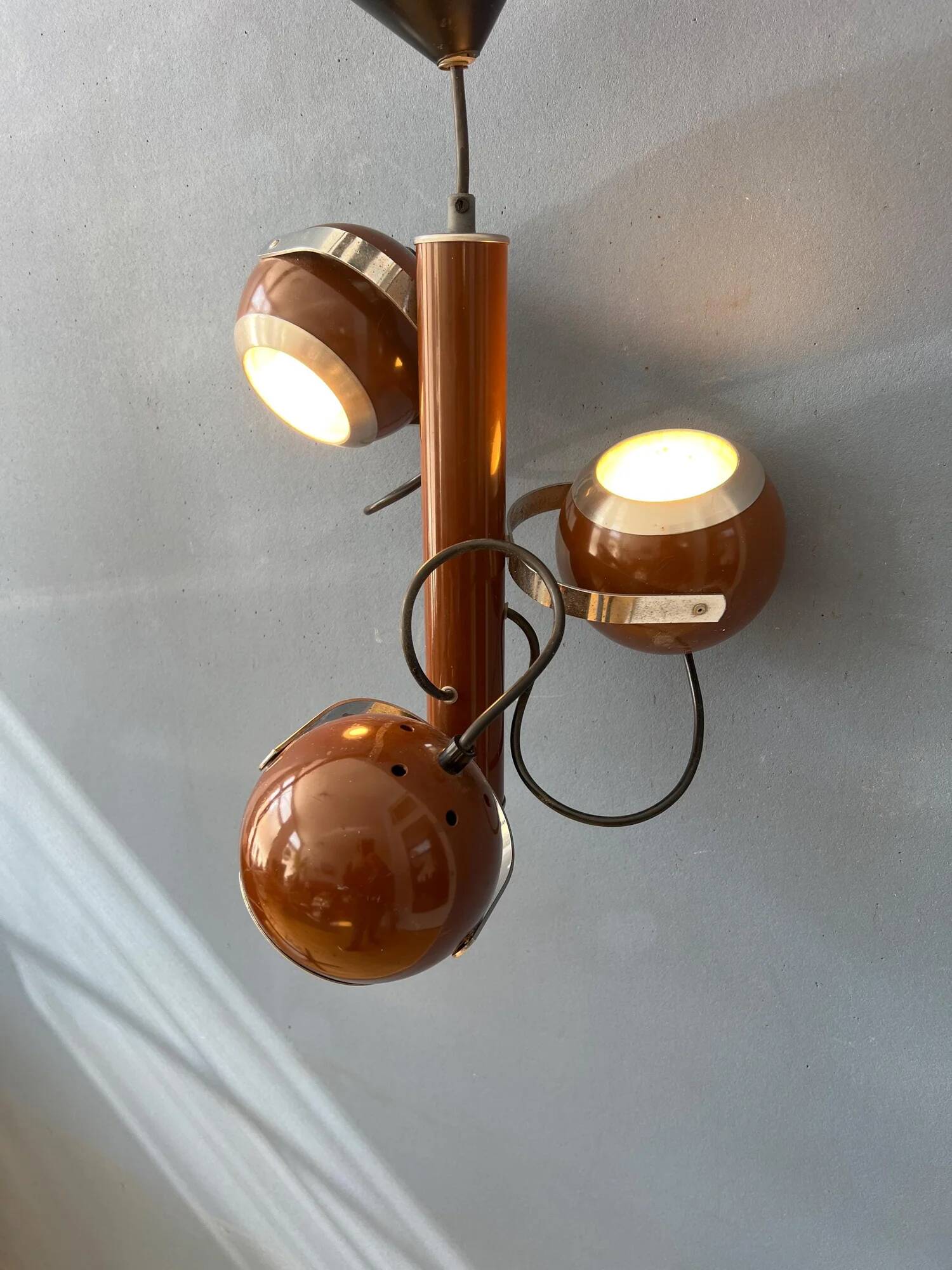 Brown vintage space age pendant lamp with three eyeball shades