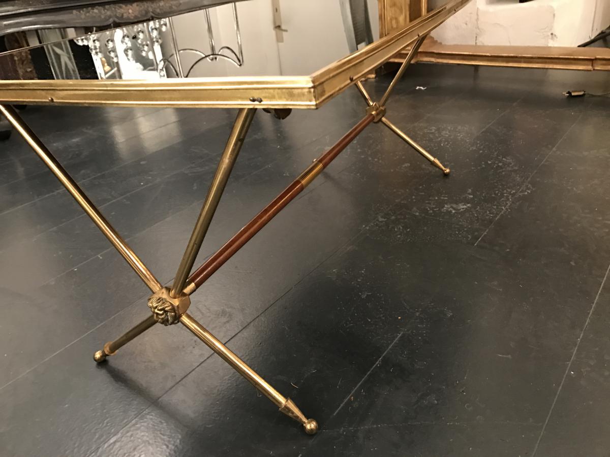 Golden brass table and lion heads circa 1950