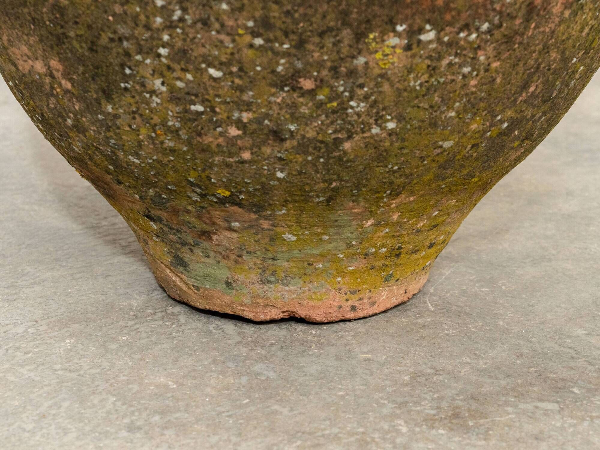 Old terracotta jar with its metal clasps, late 19th century.