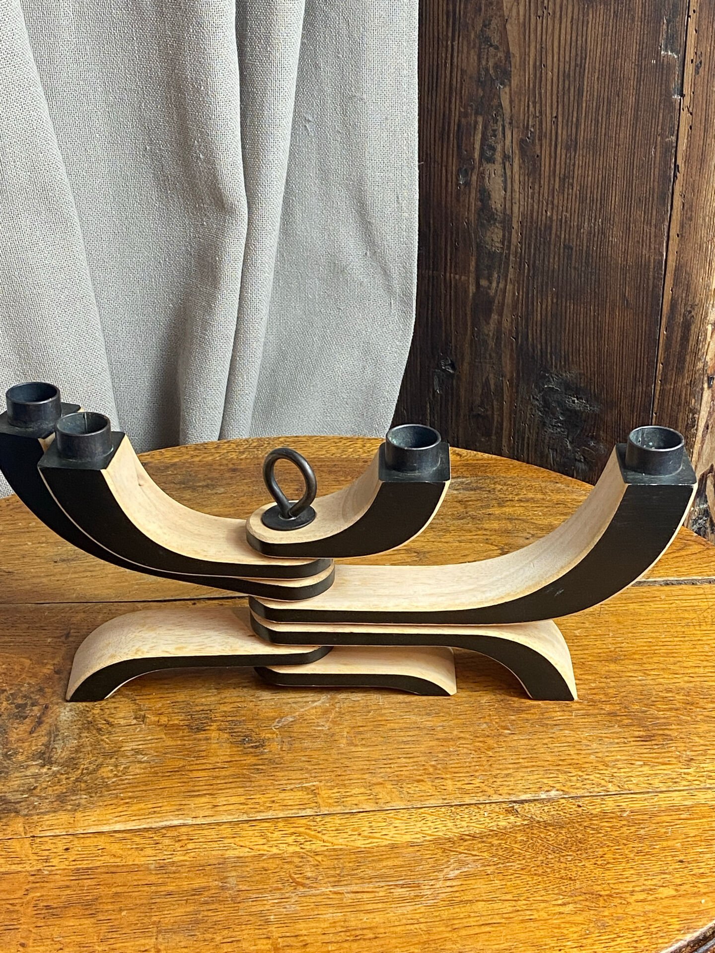 Foldable and deconstructed chandelier, minimalist Swedish design in wood.