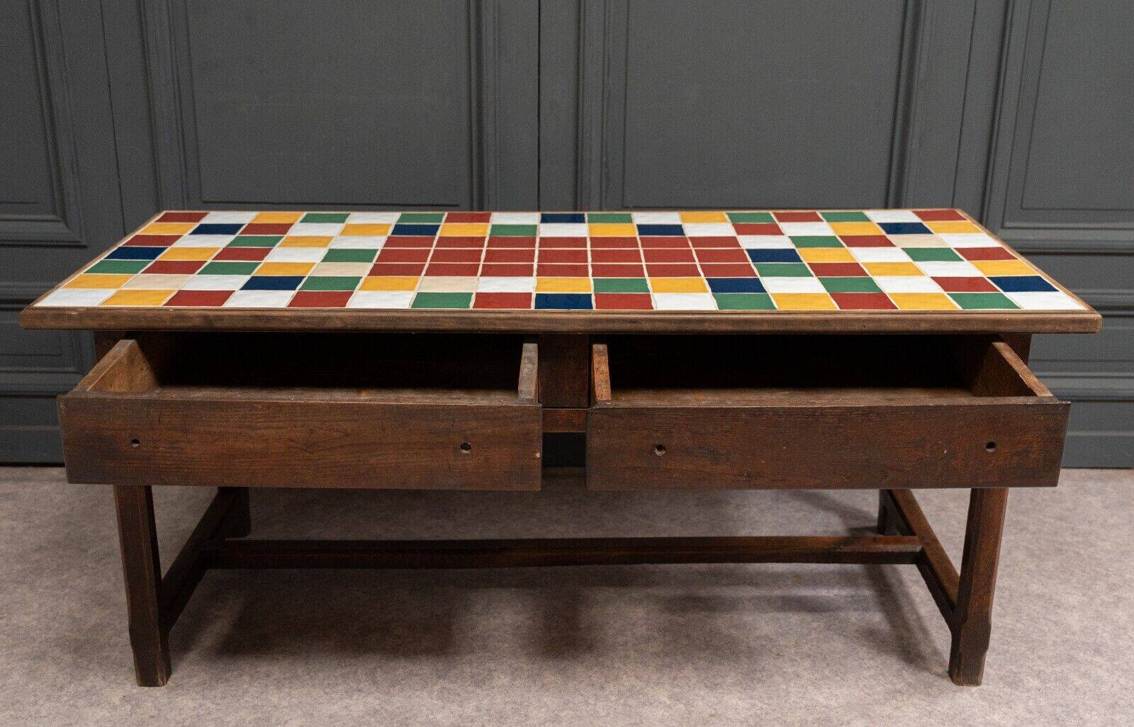 19th century oak farm table with multi-colored ceramic tiles