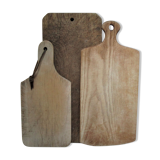 three vintage patinated solid wood cutting boards