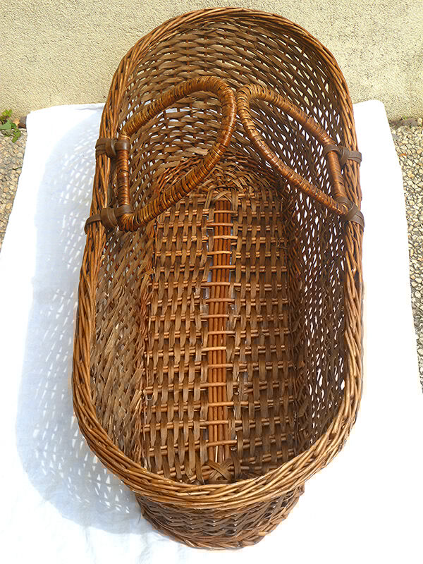 Old braided wicker couffin