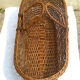 Old braided wicker couffin