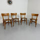 Set of 4 vintage solid oak chairs, 1960s design with sculpted backrest.