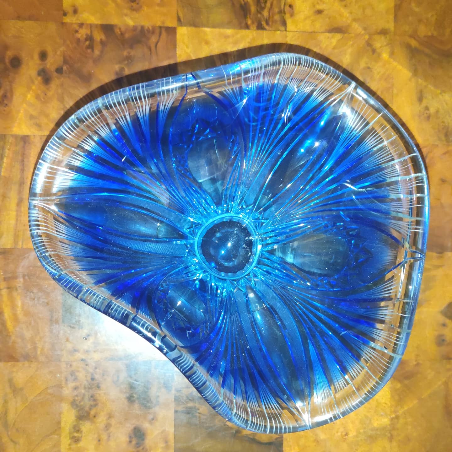Two-tone crystal fruit bowl with wheel-work design on a silver-plated metal base, circa 1930