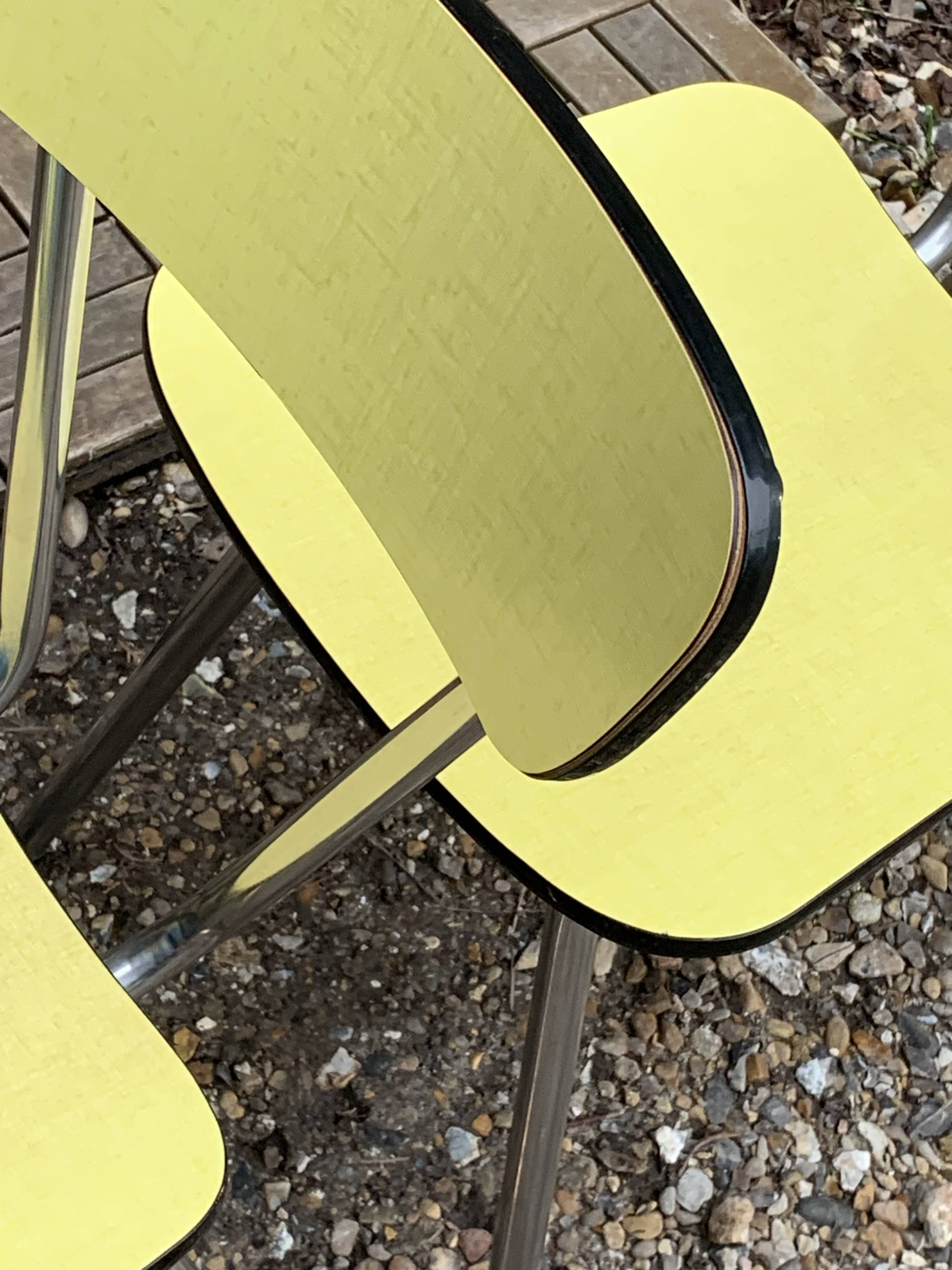 Yellow Formica chairs with compass legs, 1950s