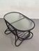 Oval coffee table from the 60s in rattan and glass.
