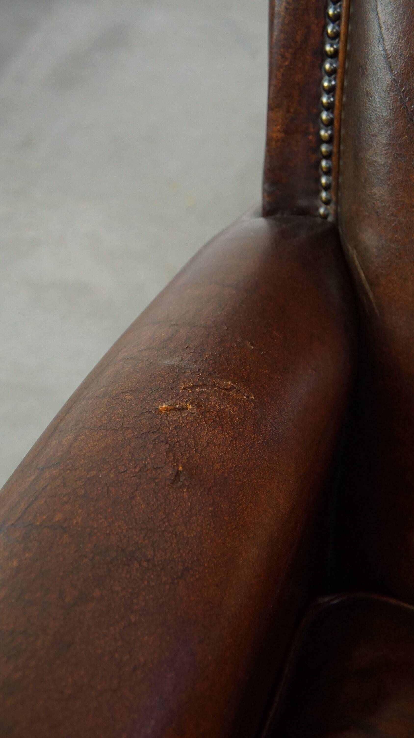 Vintage sheepskin armchair with beautiful warm colors and excellent seating comfort