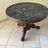 Wooden gueridon with marble, lion paw legs.